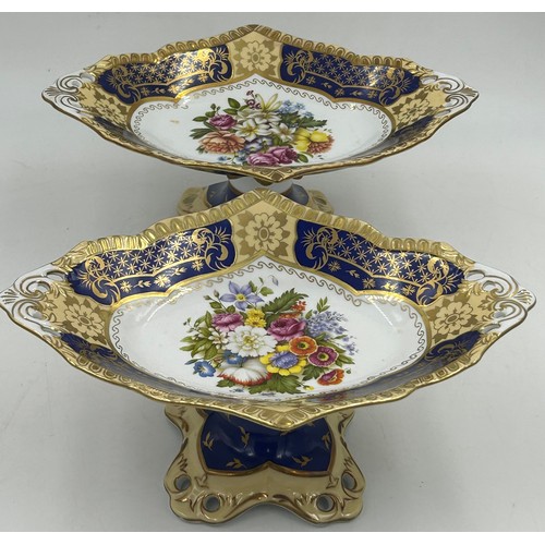 49 - Ceramics to include a pair of Continental pedestal comports with crossed sword mark to base, a pierc... 