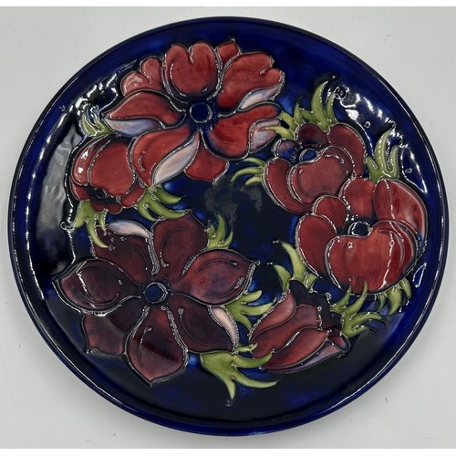 50 - Two Moorcroft Anemone patterned plates one in the green colourway 31cm d and one in blue 25.5cm d. B... 