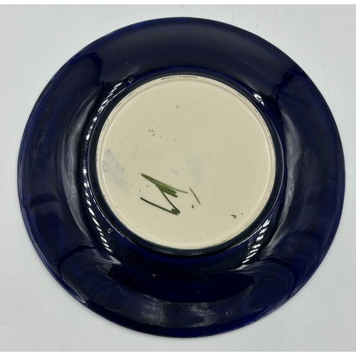 50 - Two Moorcroft Anemone patterned plates one in the green colourway 31cm d and one in blue 25.5cm d. B... 