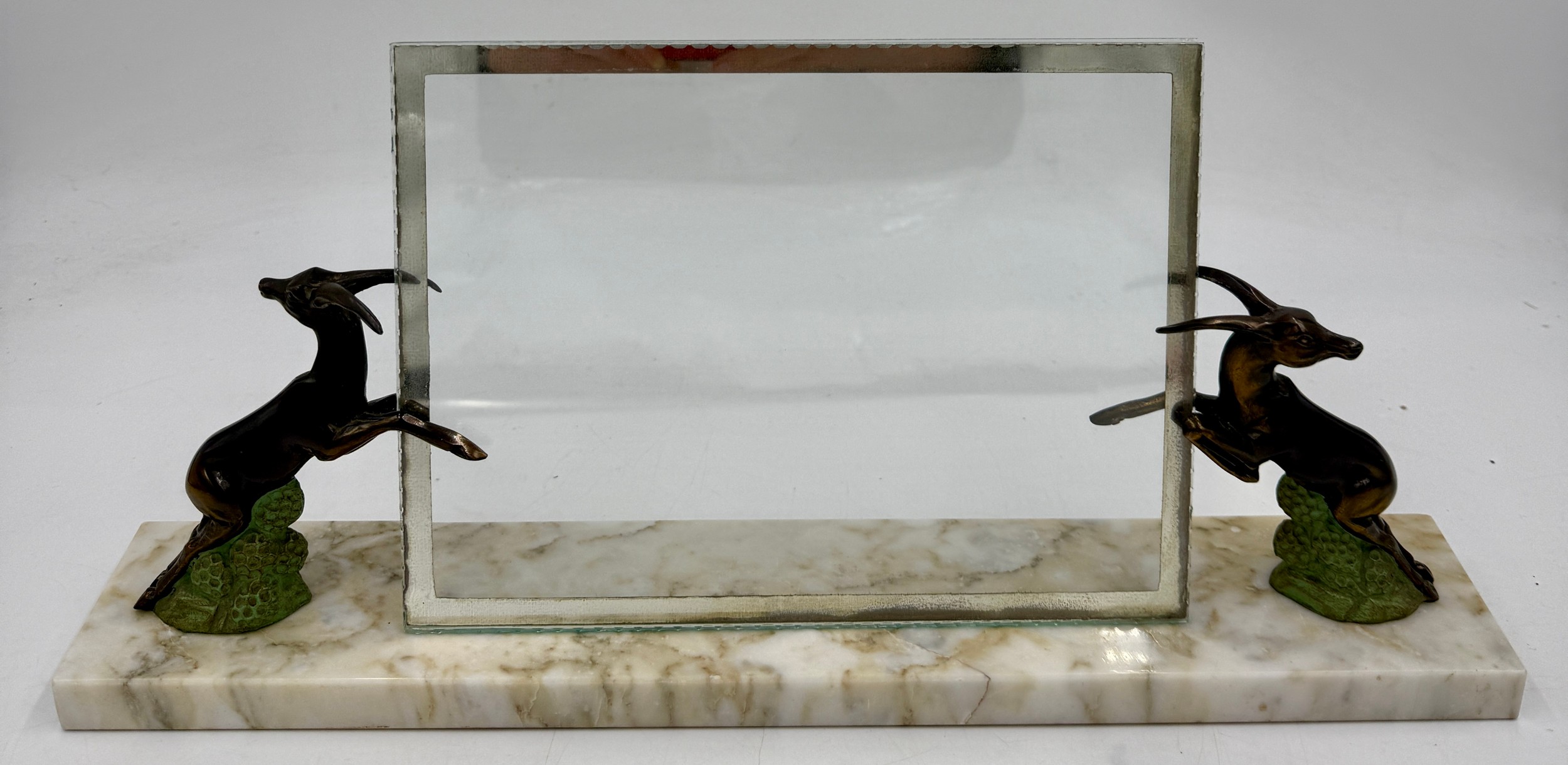 A French glass photograph frame held in place by two rearing dear ...