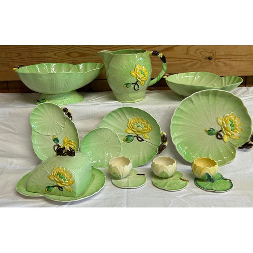 57 - A collection of Water Lily Carlton Ware comprising of a cheese dish, footed bowl, jug, strainer dish... 
