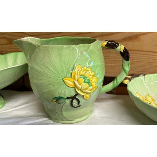 57 - A collection of Water Lily Carlton Ware comprising of a cheese dish, footed bowl, jug, strainer dish... 
