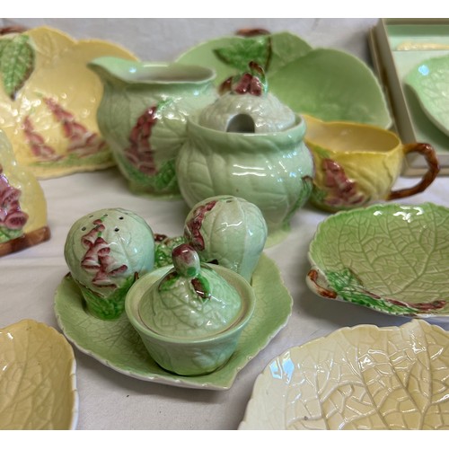 59 - A collection of Foxglove Carlton Ware in yellow and green comprising of dishes, plates, jugs, condim... 