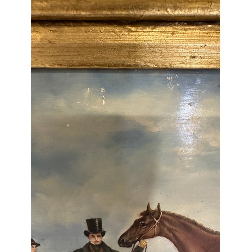 754 - A 19thC/early 20thC oil on board depicting a racehorse, jockey and probable owner in a very heavy gi... 