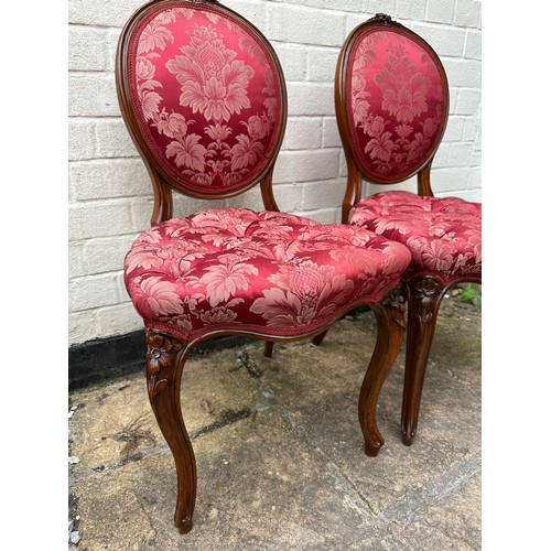 6 - A pair of Victorian mahogany framed salon chairs with floral carving. 86 h x 44 w x 44cm d. Height t... 
