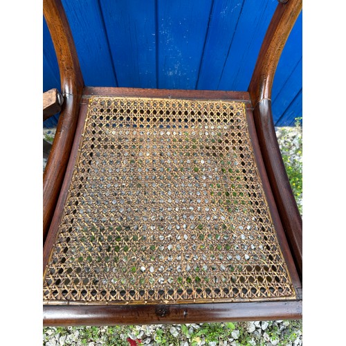 7 - A set of six Regency mahogany, bar backed dining chairs with cane seats and sabre legs to the front.... 