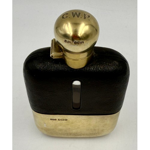 24 - A hallmarked silver and leather mounted hip flask. Height 14.5 cm. Sheffield 1912, maker James Dixon... 