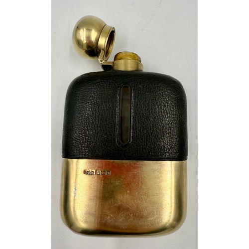 24 - A hallmarked silver and leather mounted hip flask. Height 14.5 cm. Sheffield 1912, maker James Dixon... 