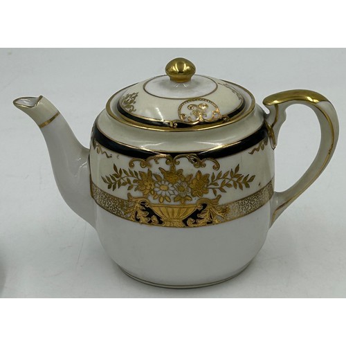 216 - A Noritake part dinner service pattern 44318 to include 2 x serving plates largest 35cm, lidded ture... 