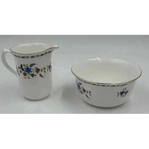 214 - A Shelley Chelsea pattern tea service to include a square cake plate, a teapot with stand, a lidded ... 