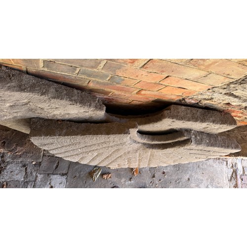 17 - A large antique sandstone mill stone in two pieces. 127cm d approx.