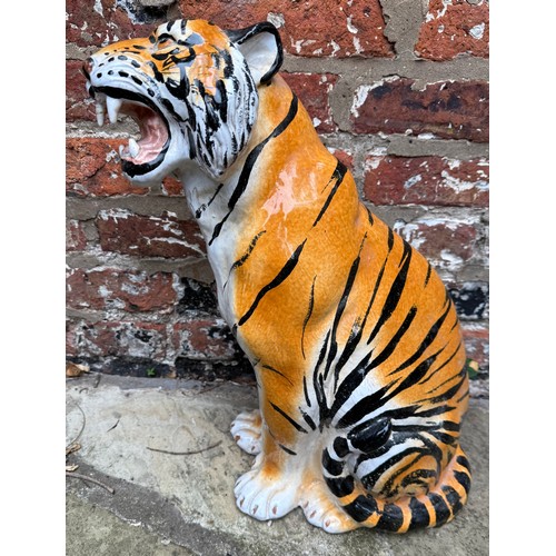 229 - A terracotta tiger 48cm h. Made in Italy.