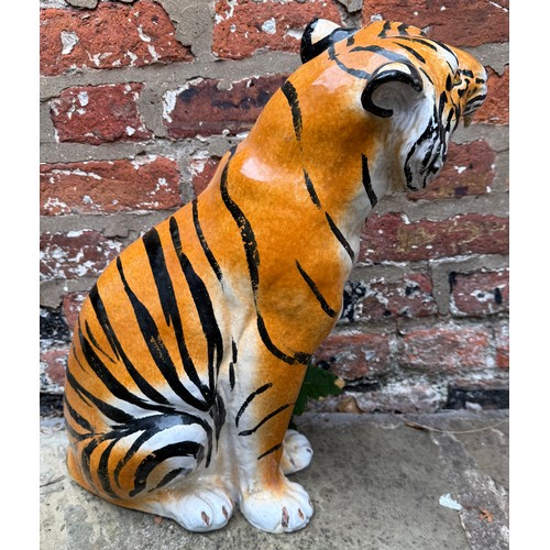 229 - A terracotta tiger 48cm h. Made in Italy.