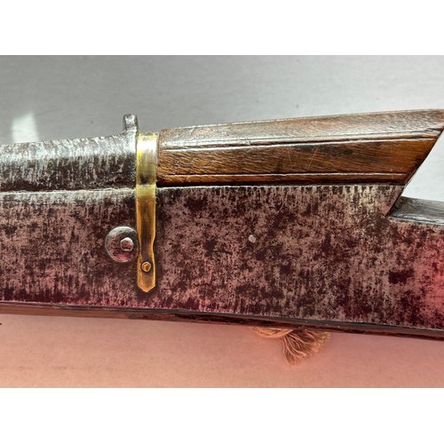 A Middle Eastern Matchlock Rifle, the wooden stock has numbers engraved ...