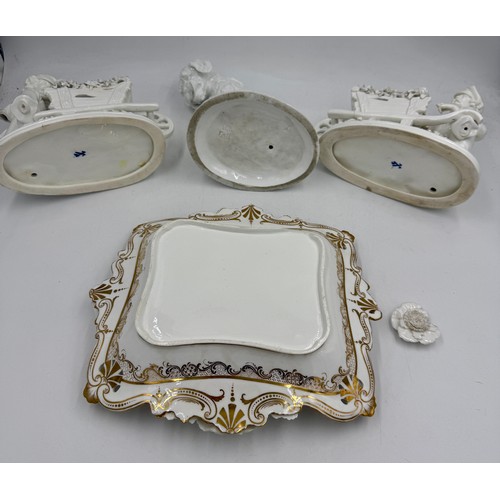 218 - Continental white porcelain figures and a white and gilt dish with floral decoration, 31cm x 26cm. (... 
