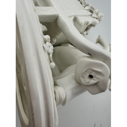 218 - Continental white porcelain figures and a white and gilt dish with floral decoration, 31cm x 26cm. (... 