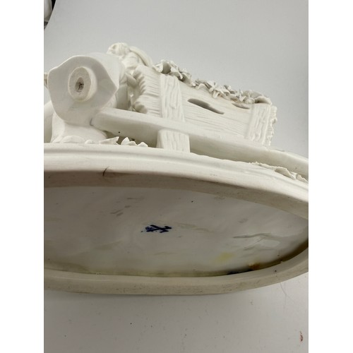 218 - Continental white porcelain figures and a white and gilt dish with floral decoration, 31cm x 26cm. (... 