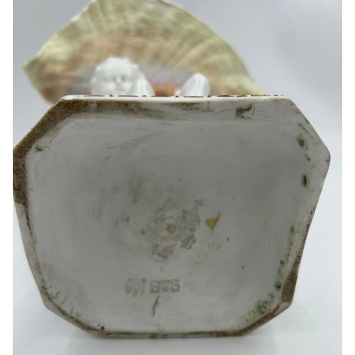 230 - A 19thC hand painted cherub bisque centrepiece with two putti and seashell together with 2 x hand pa... 