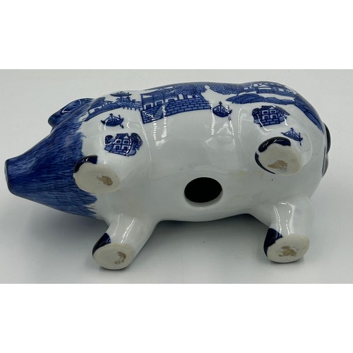 285 - Two contemporary oriental willow patterned blue and white ceramic piggy banks together with a vintag... 