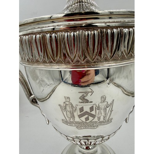 948 - A very large impressive hallmarked silver lidded trophy with snake handles, presented to the Worship... 