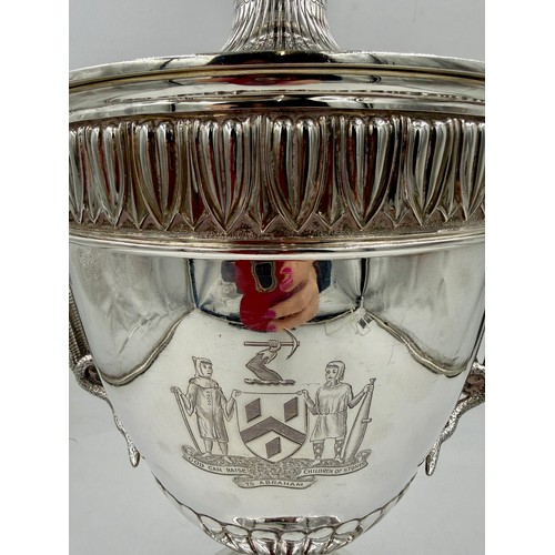 948 - A very large impressive hallmarked silver lidded trophy with snake handles, presented to the Worship... 