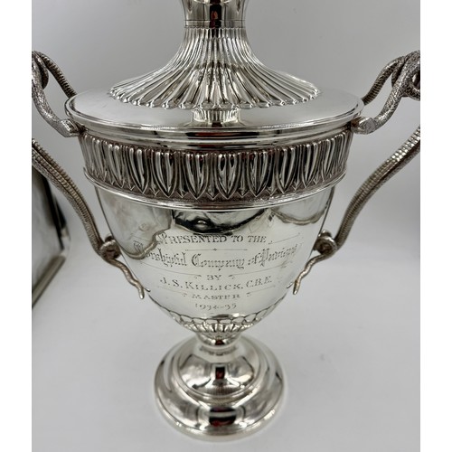 948 - A very large impressive hallmarked silver lidded trophy with snake handles, presented to the Worship... 