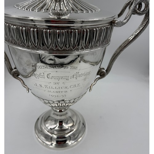 948 - A very large impressive hallmarked silver lidded trophy with snake handles, presented to the Worship... 