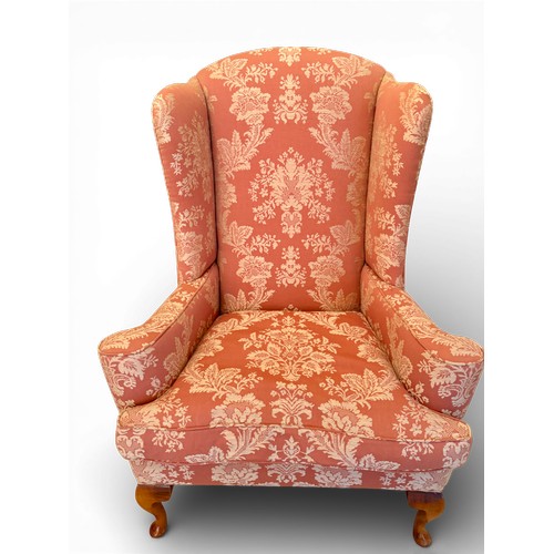 58 - A pair of wing backed armchairs and matching footstools. 119cm h to back 89cm w.