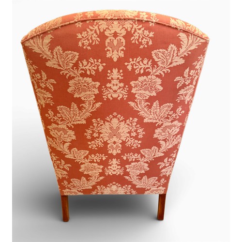 58 - A pair of wing backed armchairs and matching footstools. 119cm h to back 89cm w.