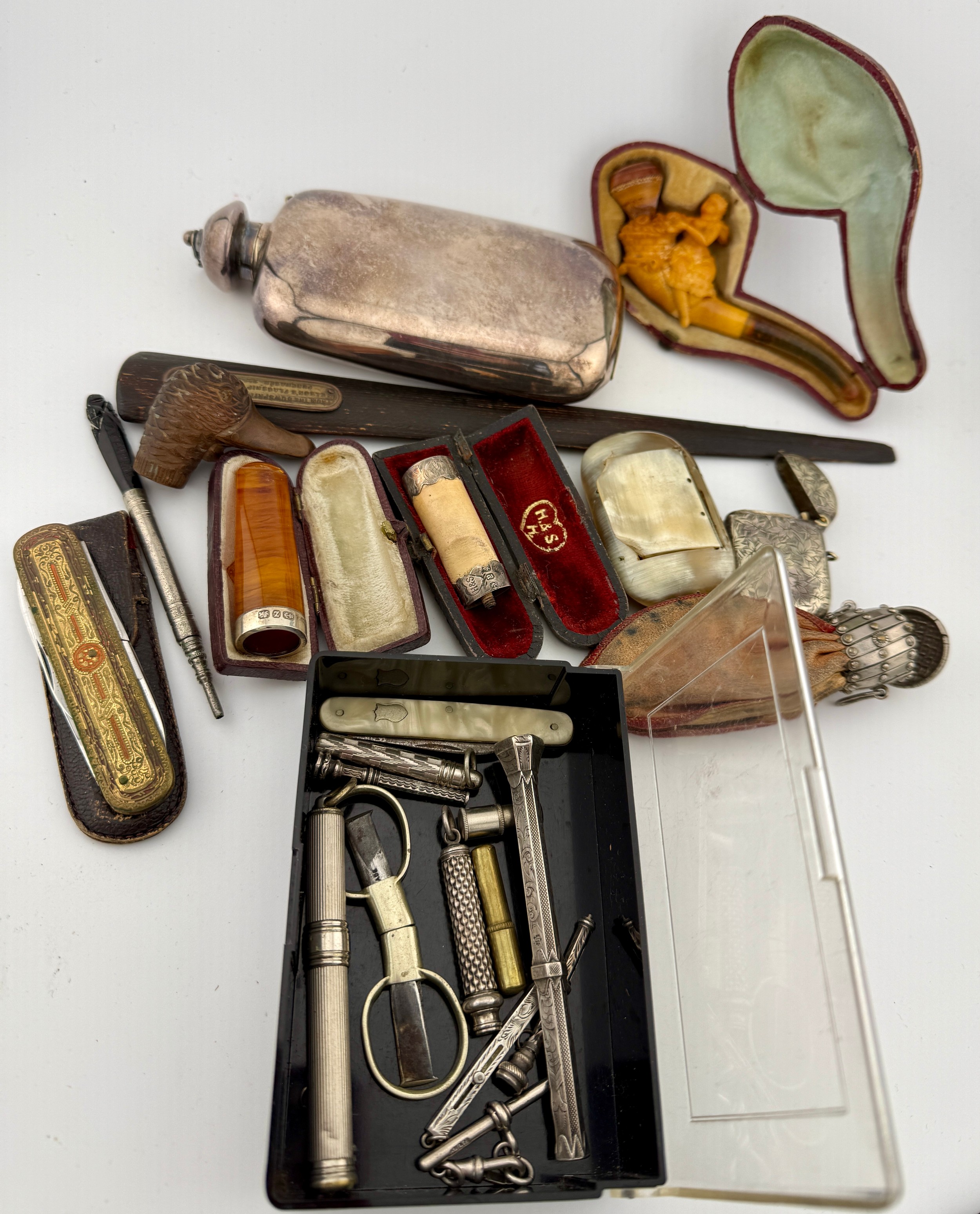 A miscellany to include meerschaum cheroot holders, amber cigar holder ...