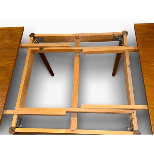 179 - A Möbler Denmark extending dining table. Extended 164cm l x 84cm w x 75cm h. Closed 85cm x 85cm.