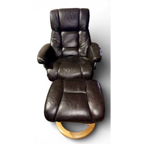 160 - A dark brown leather Stressless style reclining armchair and footstool.