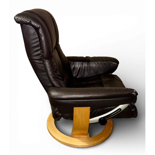 160 - A dark brown leather Stressless style reclining armchair and footstool.