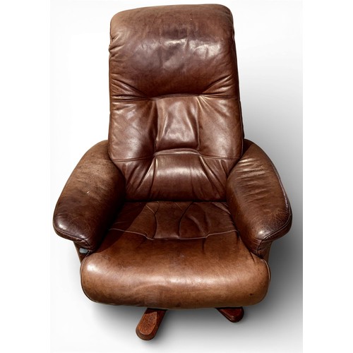 162 - A Danish brown leather recliner and footstool by Andersson.