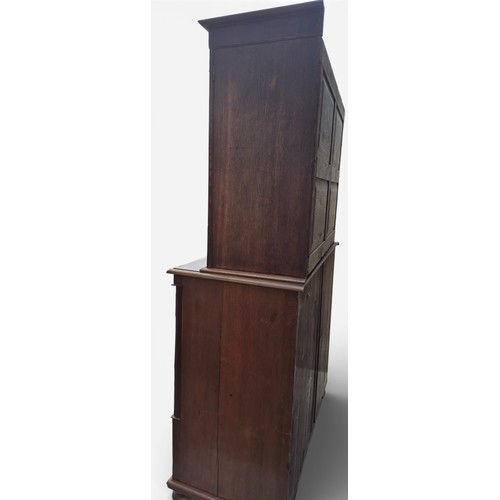 86 - A 19thC oak and cross banded linen press. 208cm h x 124cm w x 57cm d.