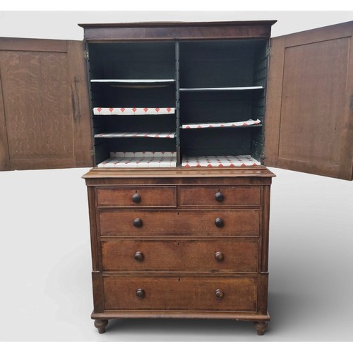86 - A 19thC oak and cross banded linen press. 208cm h x 124cm w x 57cm d.