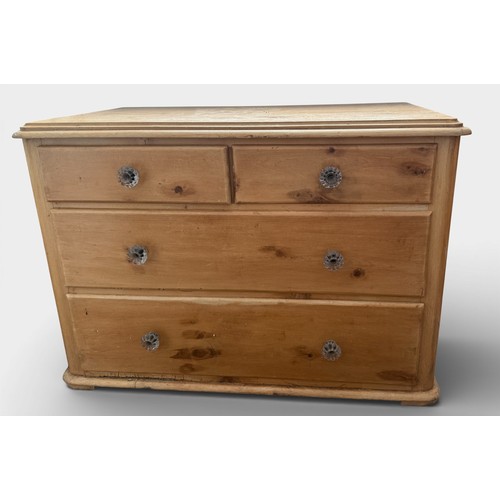 92 - A 19thC pine chest of two short over two long drawers with glass knobs. 104cm w x 57cm d x 73cm h.