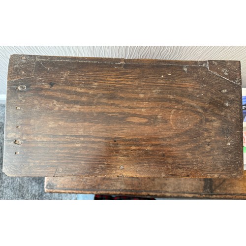 107 - An oak cupboard with single door. 37cm w x 21cm d x 38cm h.