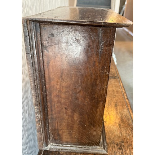 107 - An oak cupboard with single door. 37cm w x 21cm d x 38cm h.