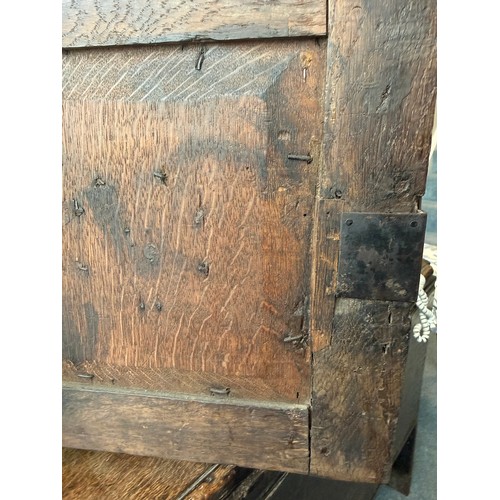 107 - An oak cupboard with single door. 37cm w x 21cm d x 38cm h.