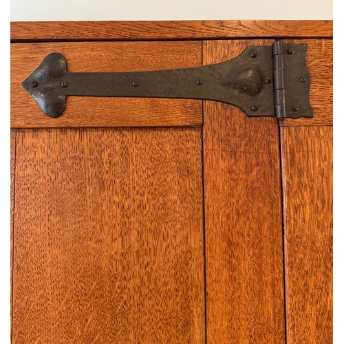 116 - An oak Arts and Craft style single door cupboard with shelving to the interior. 189cm h x 99cm w x 3... 