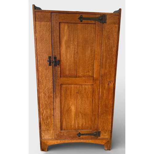 116 - An oak Arts and Craft style single door cupboard with shelving to the interior. 189cm h x 99cm w x 3... 