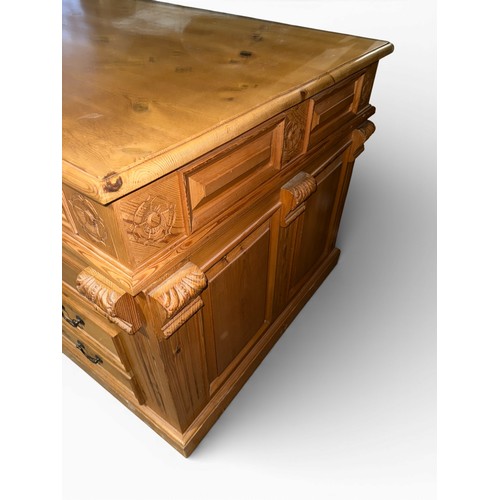 132 - A pine pedestal kneehole desk. 185cm w x 90cm d x 80cm h.