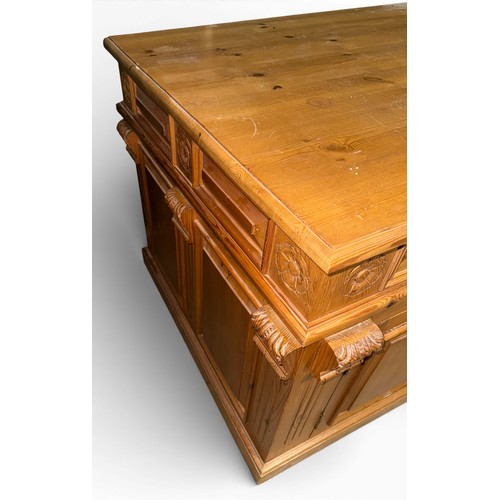 132 - A pine pedestal kneehole desk. 185cm w x 90cm d x 80cm h.