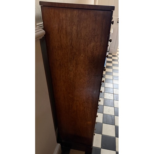 139 - A 19thC rosewood veneered chest of 12 drawers with brass knobs. 121 h  x 42 w x32cm d.