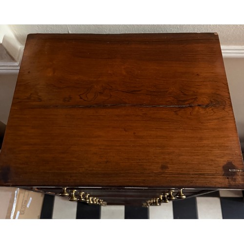 139 - A 19thC rosewood veneered chest of 12 drawers with brass knobs. 121 h  x 42 w x32cm d.