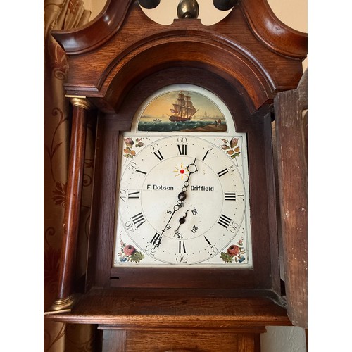 A 30 hour oak longcase clock with painted face by F. Dobson Driffield ...