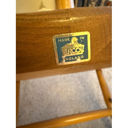 191 - A vintage Ercol rocking armchair with blue label. Height to back 85cm x 63cm across arms.