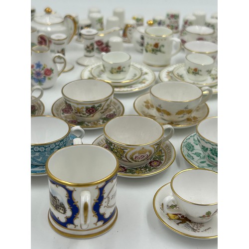 419 - Various porcelain miniatures to include mainly Spode, 2 x Royal Doulton twin handled loving cups, Co... 
