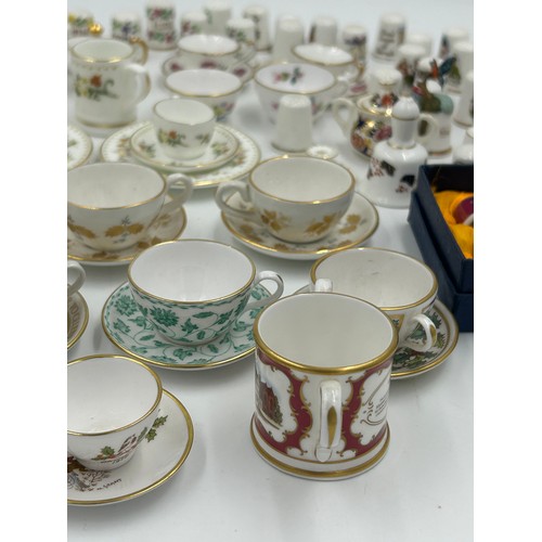 419 - Various porcelain miniatures to include mainly Spode, 2 x Royal Doulton twin handled loving cups, Co... 